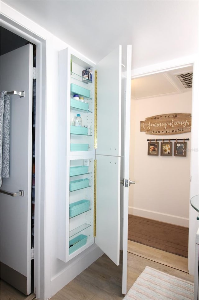 bathroom with hardwood / wood-style flooring