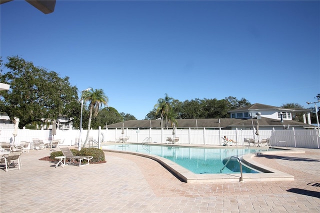 view of swimming pool featuring a patio area