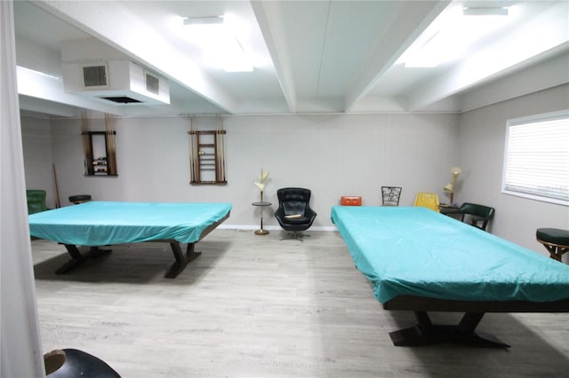 recreation room featuring beam ceiling, light wood-type flooring, and billiards