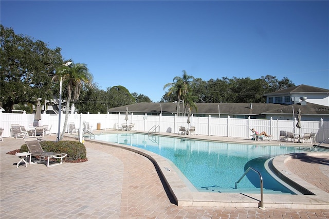 view of swimming pool featuring a patio