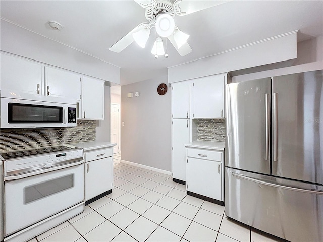 kitchen with tasteful backsplash, white cabinetry, ceiling fan, and appliances with stainless steel finishes