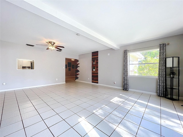 unfurnished living room featuring ceiling fan, beam ceiling, and light tile patterned floors