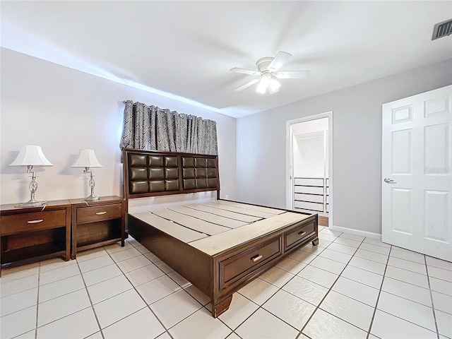 tiled bedroom with ceiling fan