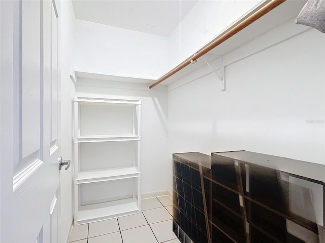 walk in closet featuring light tile patterned floors