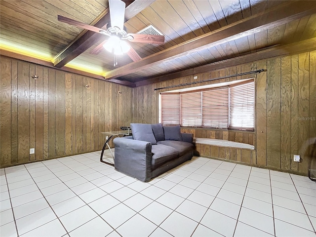 living area featuring wood walls, light tile patterned floors, and wood ceiling