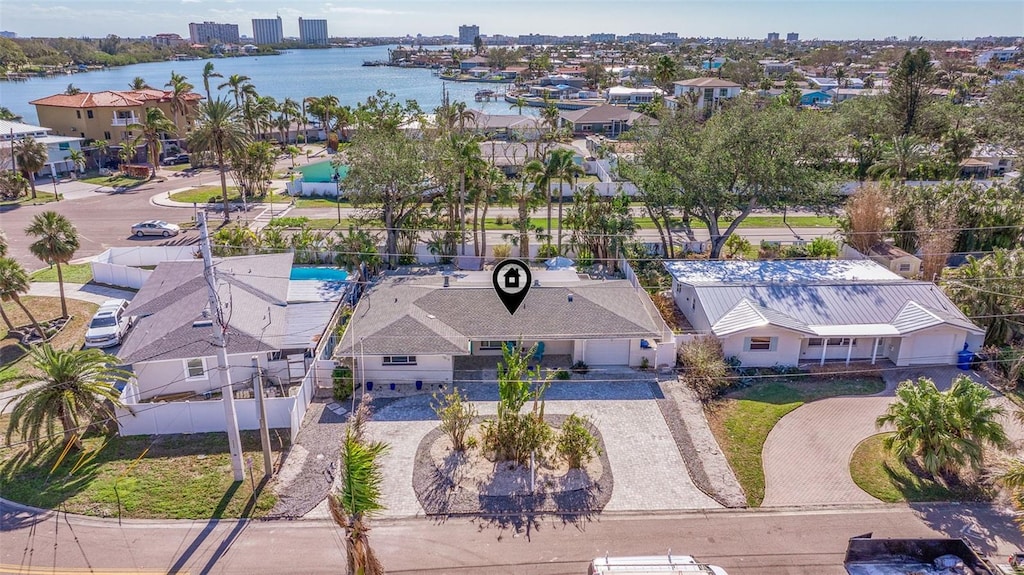 drone / aerial view with a water view and a residential view