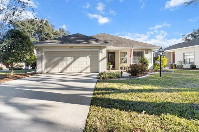 ranch-style house featuring a garage and a front lawn