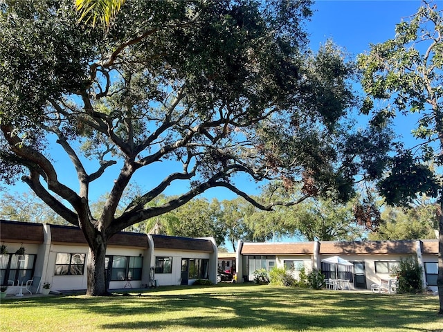 exterior space with a front lawn