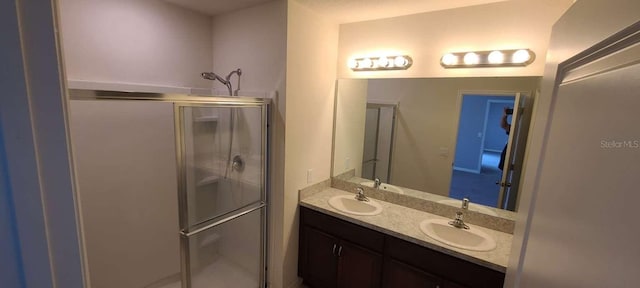 bathroom featuring vanity and walk in shower