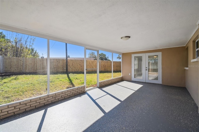 unfurnished sunroom with french doors