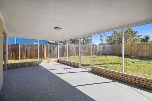 unfurnished sunroom featuring a wealth of natural light