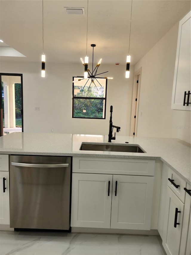 kitchen featuring sink, a notable chandelier, dishwasher, white cabinetry, and hanging light fixtures