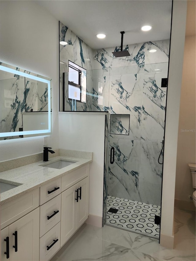 bathroom featuring vanity, an enclosed shower, and toilet