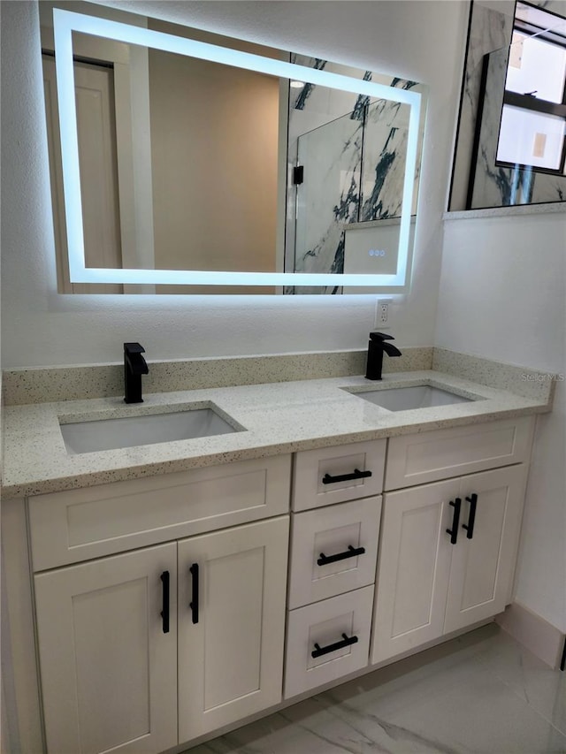 bathroom featuring vanity and a shower with shower door