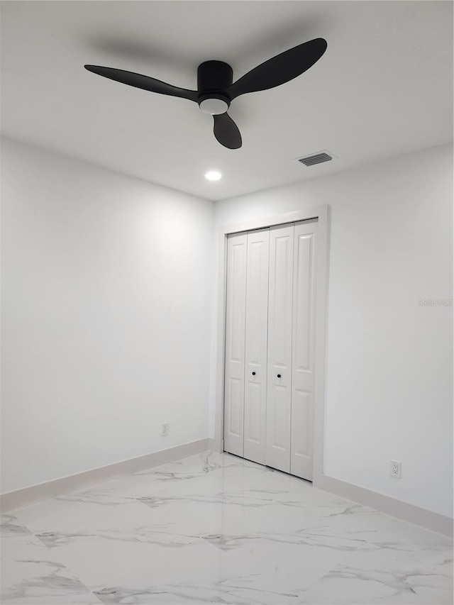 unfurnished bedroom with a closet and ceiling fan