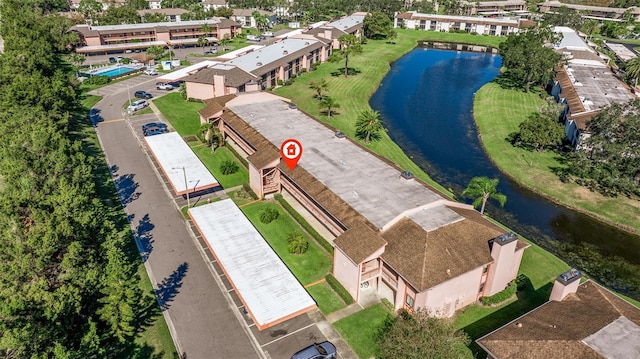 birds eye view of property featuring a water view