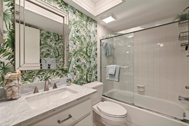 full bathroom with vanity, toilet, and bath / shower combo with glass door