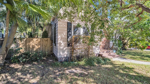 view of side of property featuring a yard