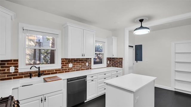 kitchen with plenty of natural light, white cabinetry, black dishwasher, and hanging light fixtures