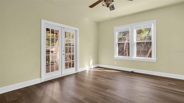 spare room with ceiling fan and dark wood-type flooring