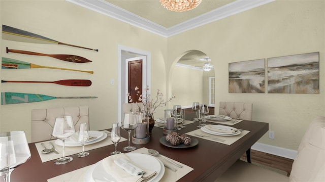 dining area featuring wood-type flooring and ornamental molding