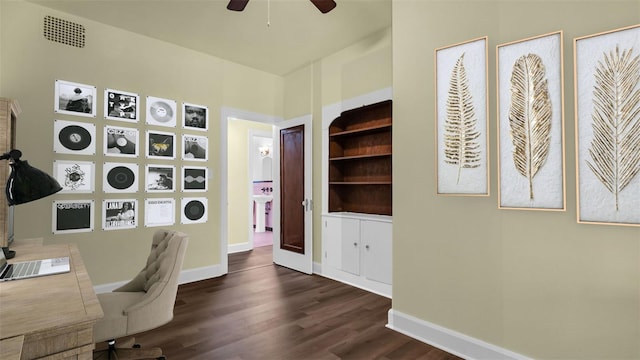 home office featuring dark hardwood / wood-style flooring and ceiling fan