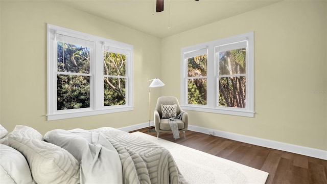 bedroom with hardwood / wood-style floors and ceiling fan