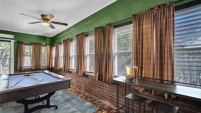 recreation room with brick wall, ceiling fan, and billiards