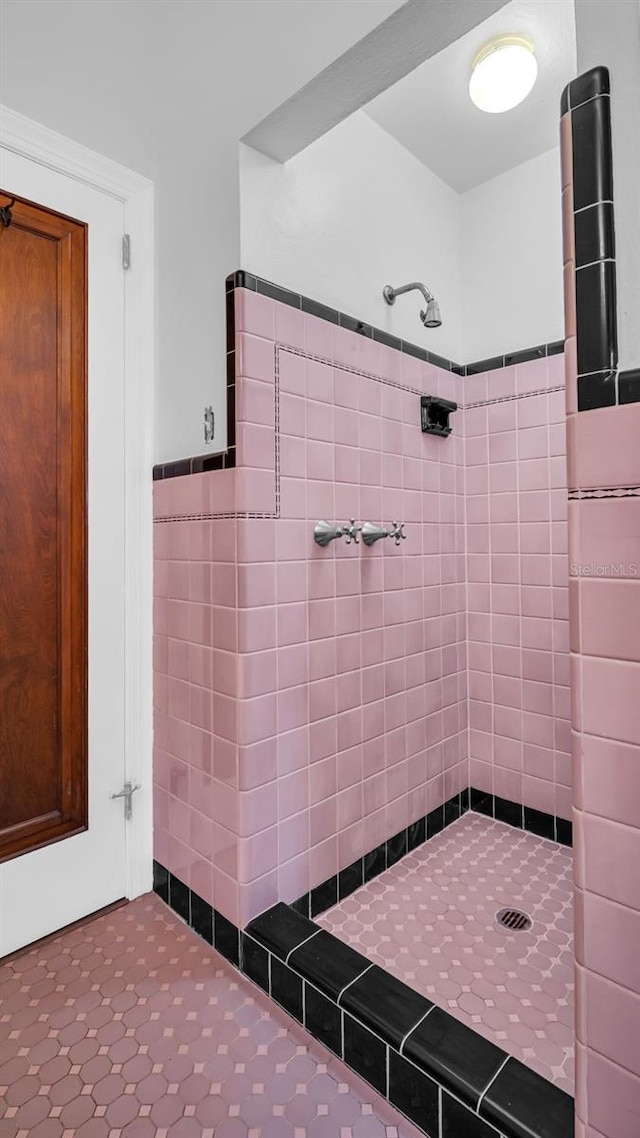 bathroom with tiled shower