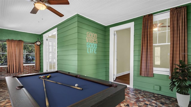 rec room featuring ceiling fan, wooden walls, and billiards