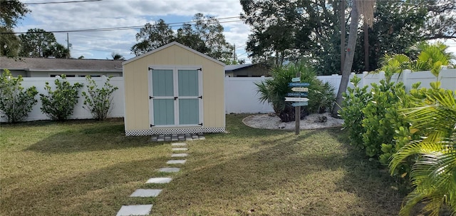 view of outbuilding with a lawn