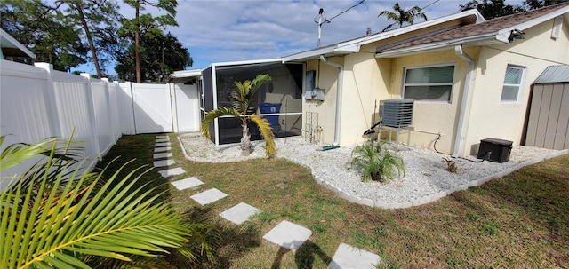 view of yard featuring central AC unit