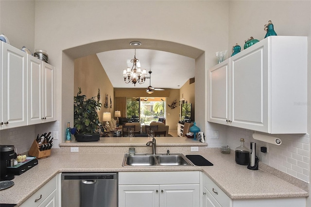 kitchen featuring dishwasher, white cabinets, hanging light fixtures, and sink