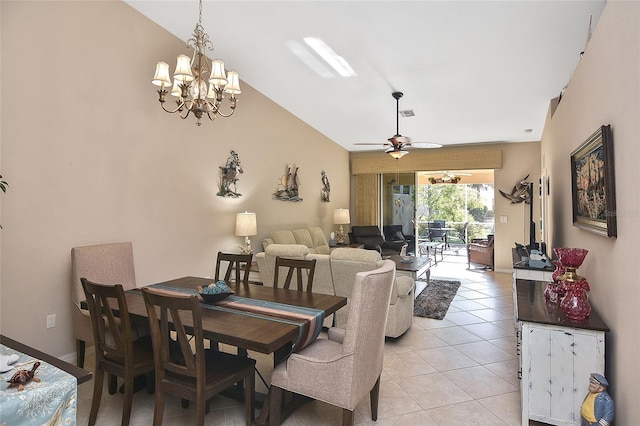 tiled dining area with ceiling fan with notable chandelier and lofted ceiling