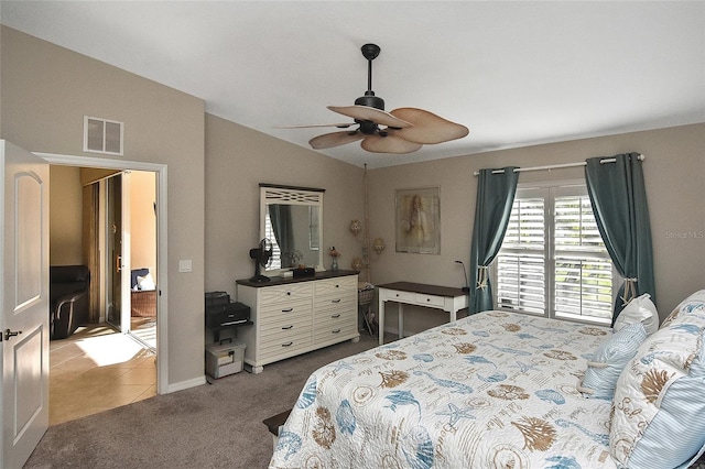 bedroom with carpet floors, vaulted ceiling, and ceiling fan