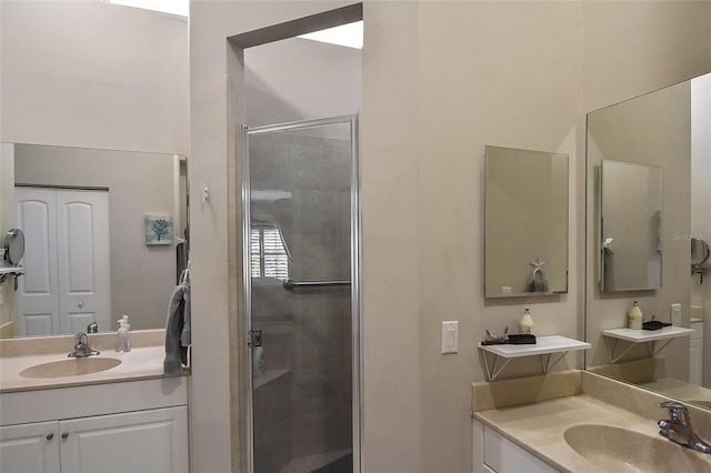 bathroom with vanity and a shower with shower door