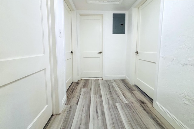 hall featuring electric panel and light wood-type flooring