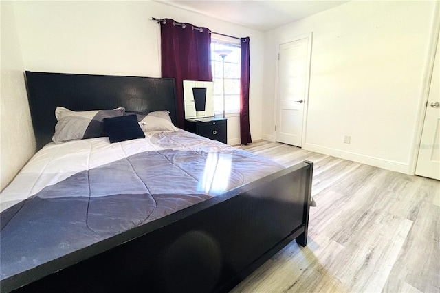 bedroom featuring light wood-type flooring