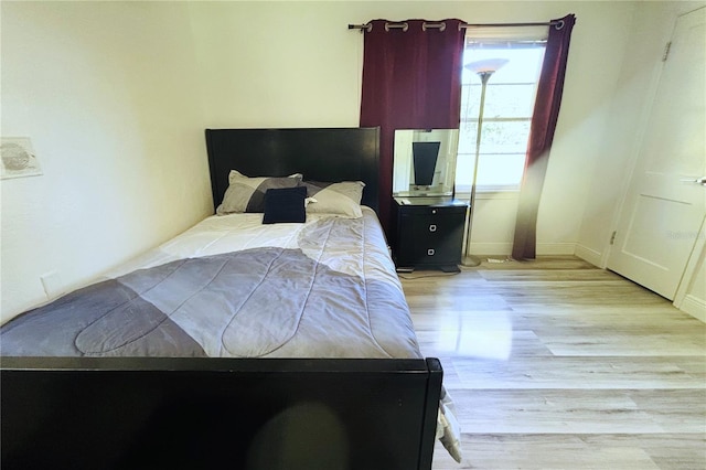 bedroom with light hardwood / wood-style floors