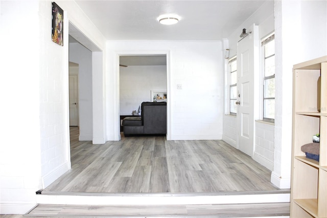 hall with light wood-type flooring