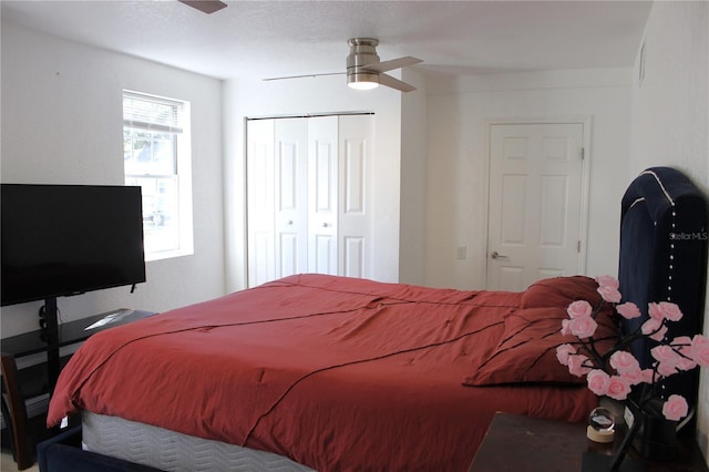 bedroom featuring ceiling fan and a closet