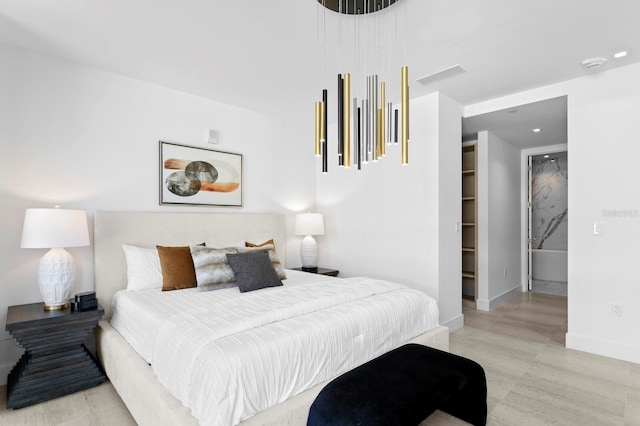 bedroom featuring a walk in closet