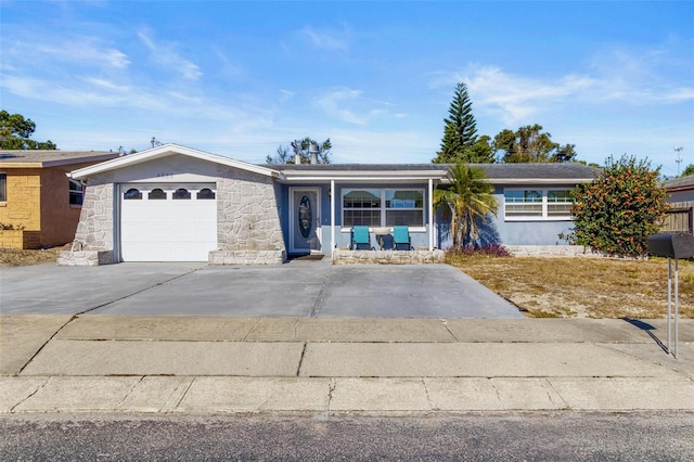 ranch-style house with a porch and a garage