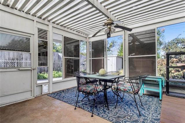 sunroom featuring ceiling fan