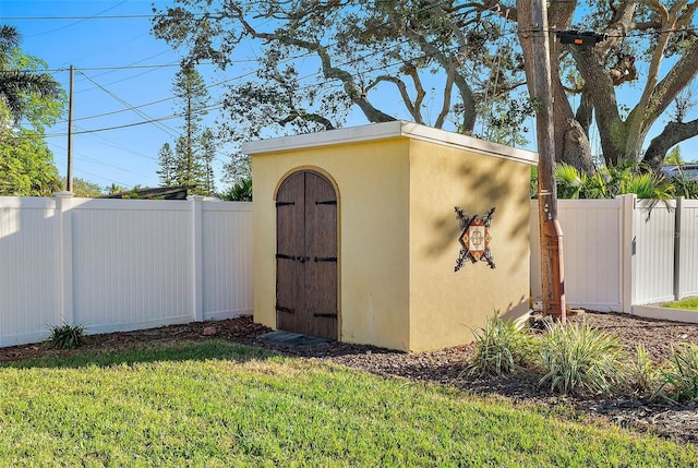 view of shed with fence