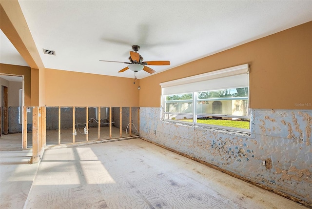 spare room with a ceiling fan and visible vents