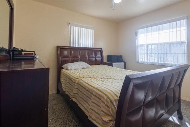 carpeted bedroom with ceiling fan and a closet