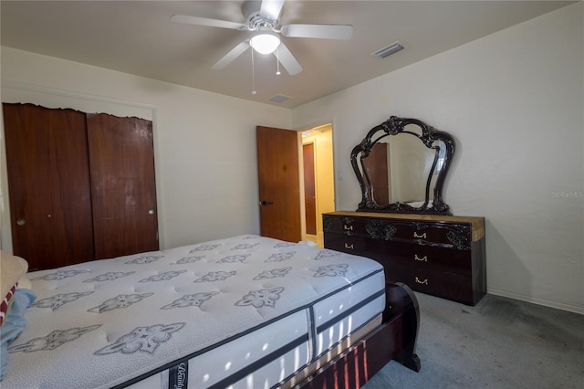 carpeted bedroom featuring a closet and ceiling fan