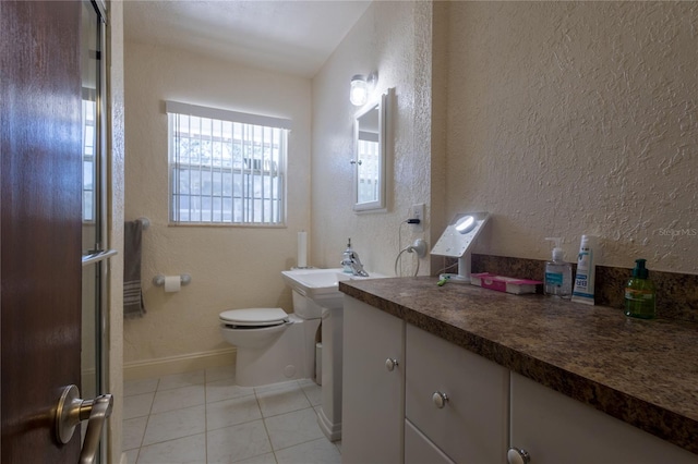 bathroom with toilet, tile patterned floors, and a shower with shower door