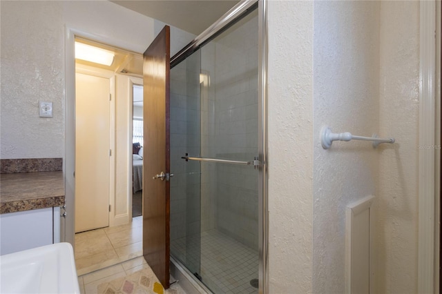 bathroom featuring tile patterned floors and walk in shower